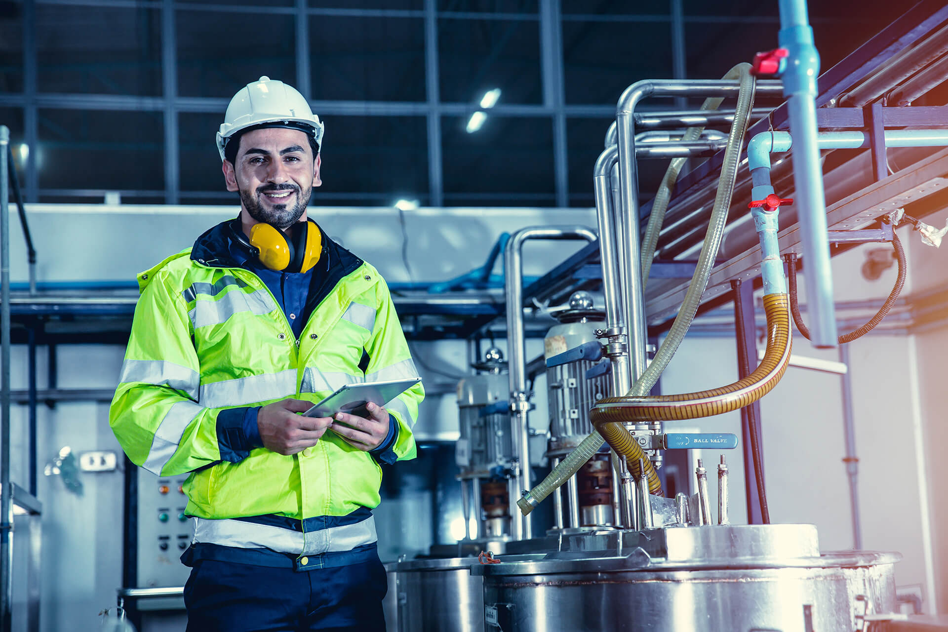 happy engineer male worker working in factory